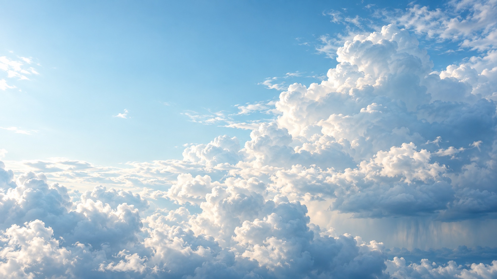 Lichtdurchfluteter blauer Himmel mit weißen Wolken und einem fernen Regenschauer